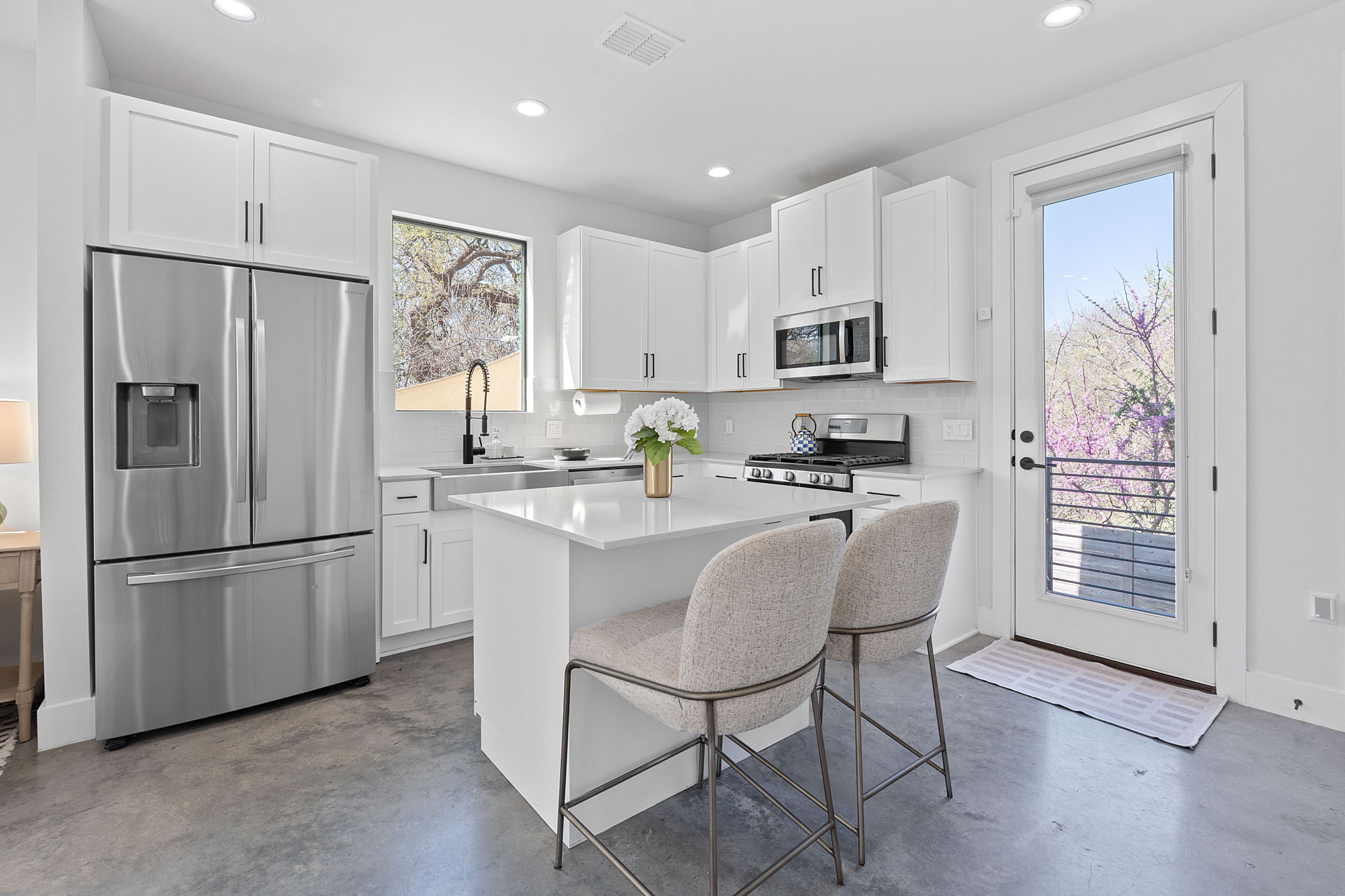 1168 Ridgeway Drive, Unit 2 Austin, TX 78702 - Photo 5 of 26 a kitchen with stainless steel appliances granite countertop a refrigerator sink and cabinets