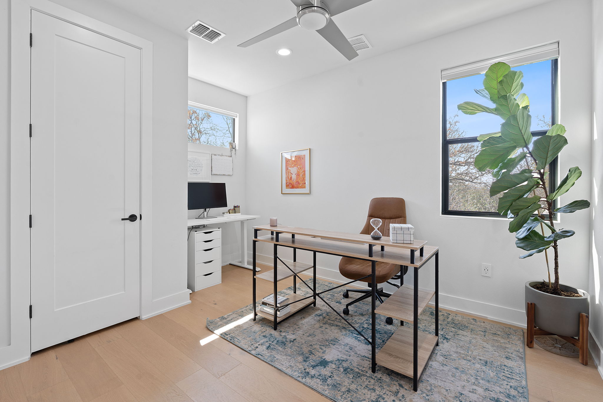 1168 Ridgeway Drive, Unit 2 Austin, TX 78702 - Photo 10 of 26 a workspace with furniture and a potted plant
