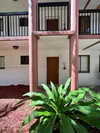 a flower plants in front of a house