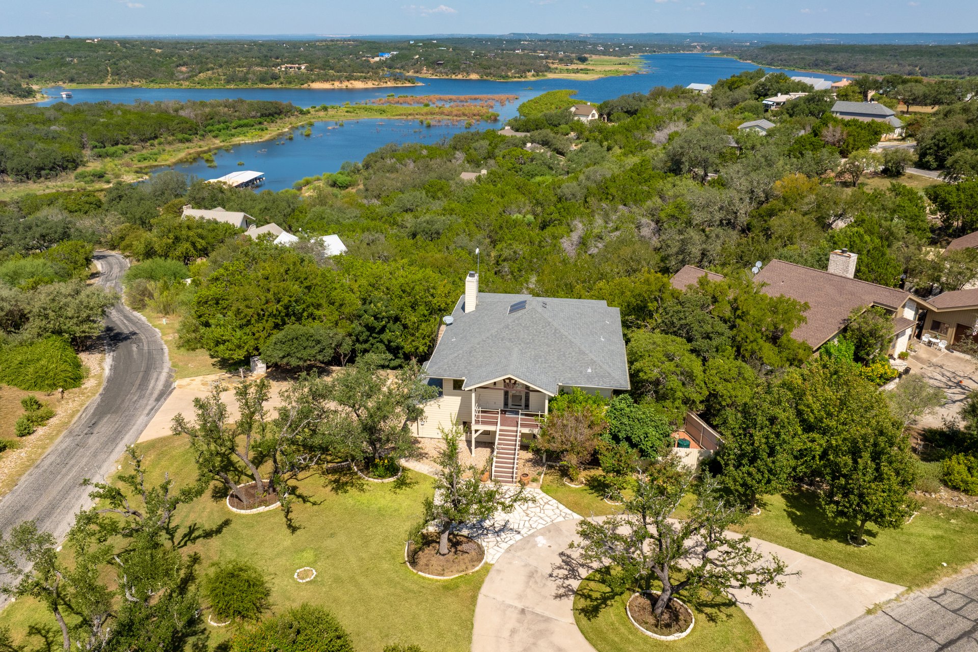 an aerial view of residential houses with outdoor space