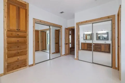 a view of front door with wooden floor