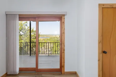 a view of front door with wooden floor