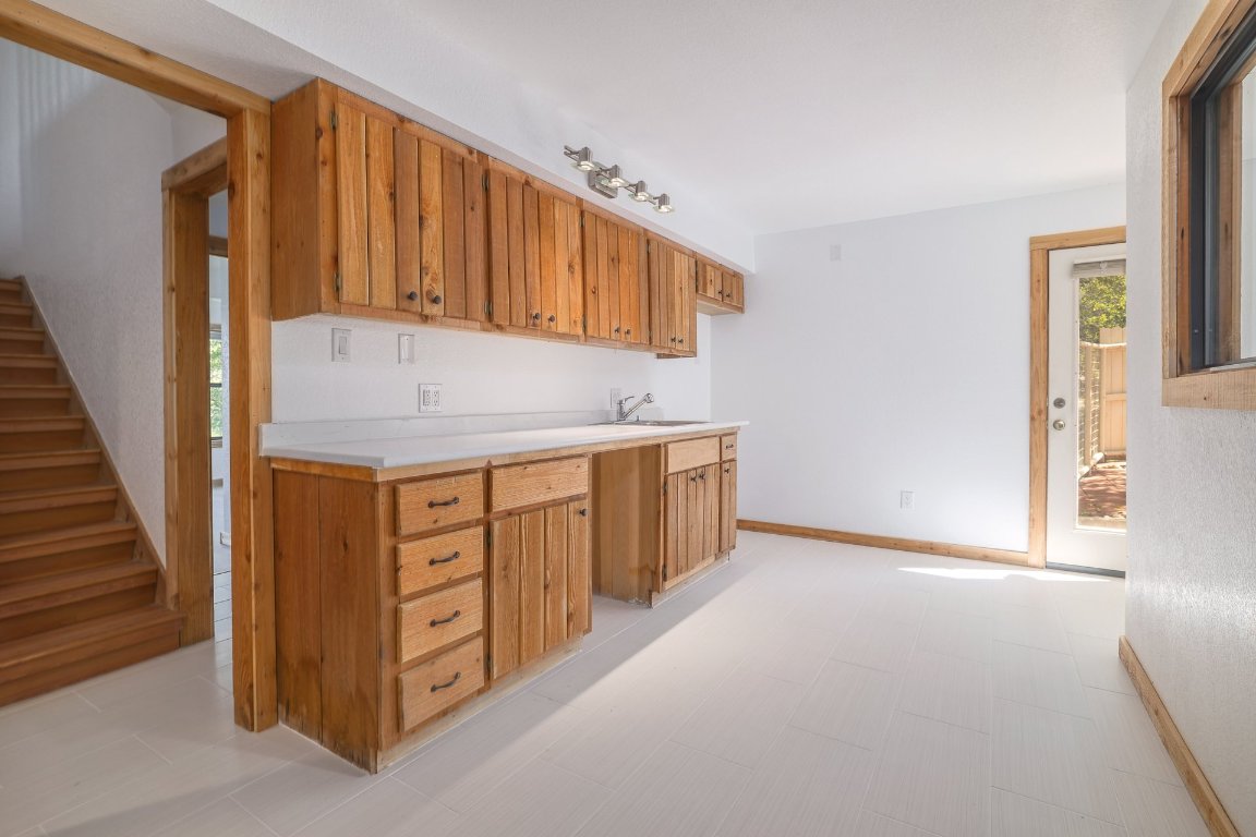 313 Kendall Road Spicewood, TX 78669 - Photo 22 of 34 a view of a kitchen with cabinets