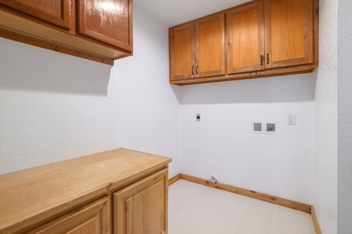 313 Kendall Road Spicewood, TX 78669 - Photo 23 of 34 a utility room with dryer and washer