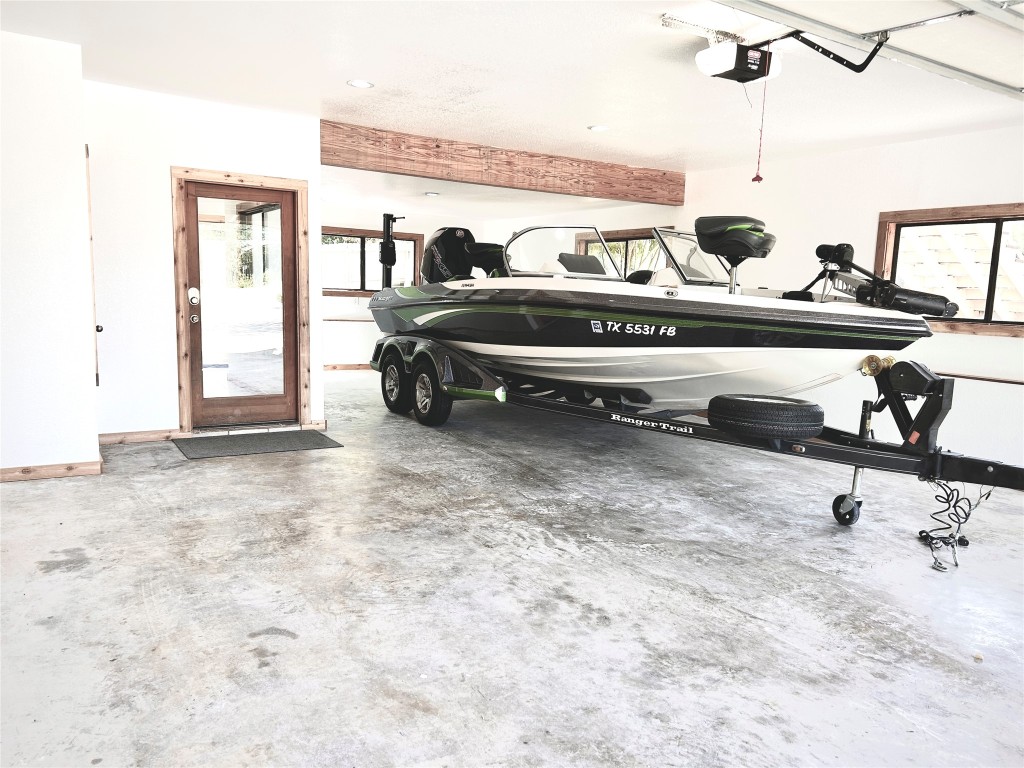 313 Kendall Road Spicewood, TX 78669 - Photo 25 of 34 a bedroom with a bed and gym equipment