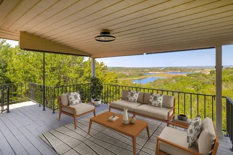 a view of a balcony with lake view