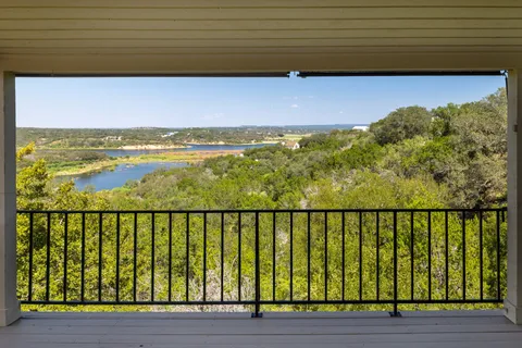 a view of a balcony with an ocean view
