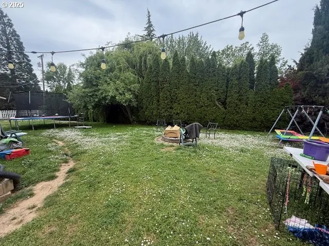 a view of a backyard with plants and outdoor seating