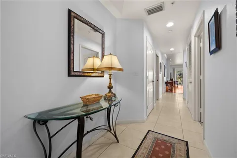 a view of a ocean with boats and palm trees