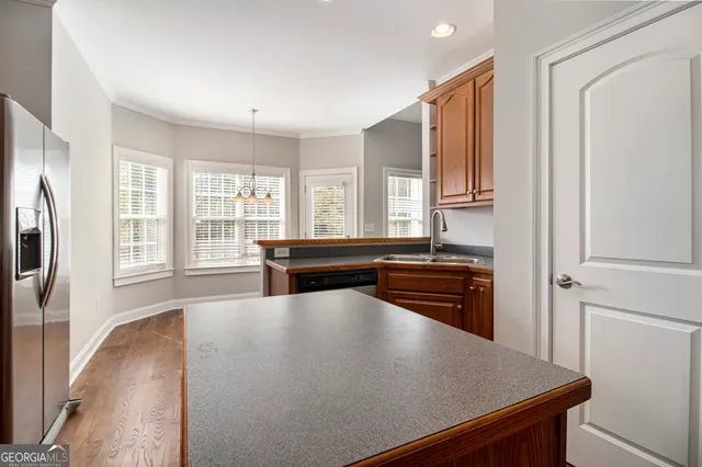a kitchen with stainless steel appliances a stove and a refrigerator