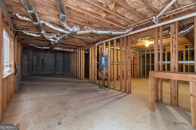 a view of an empty room with wooden walls
