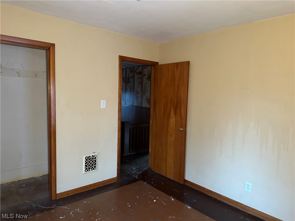 5112 Reed Avenue Ashtabula, OH 44004 - Photo 9 of 21 Unfurnished bedroom with a closet and a walk in closet