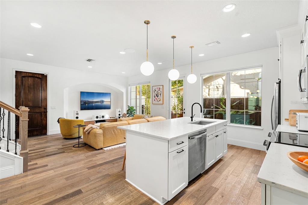 1732 Ridgewood Avenue, Unit S Maitland, FL 32751 - Photo 11 of 31 a large kitchen with kitchen island a large island in the center