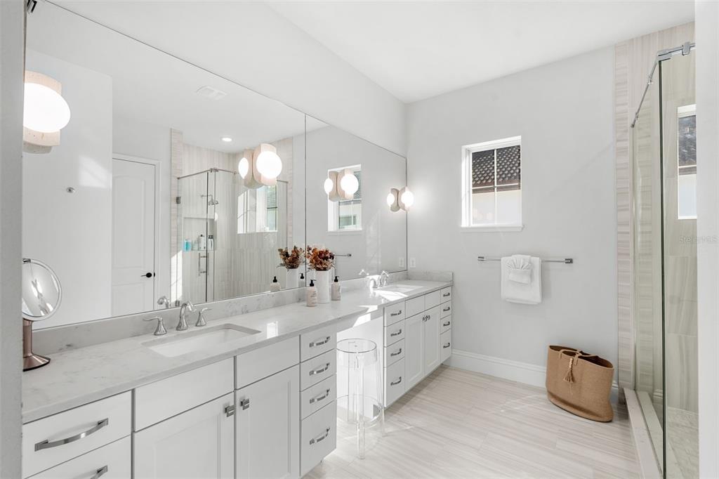 1732 Ridgewood Avenue, Unit S Maitland, FL 32751 - Photo 20 of 31 a bathroom with double sink and a mirror