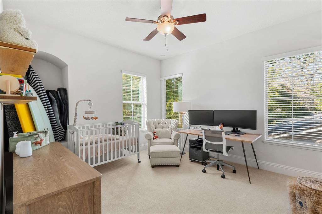 1732 Ridgewood Avenue, Unit S Maitland, FL 32751 - Photo 21 of 31 a bedroom with furniture and a window