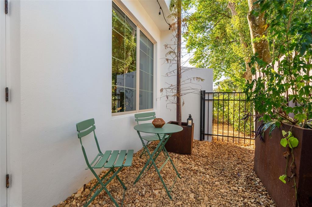 1732 Ridgewood Avenue, Unit S Maitland, FL 32751 - Photo 27 of 31 a view of a house with backyard and sitting area