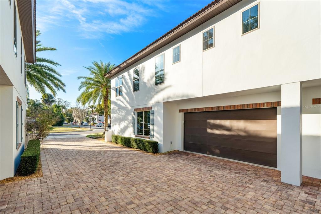 1732 Ridgewood Avenue, Unit S Maitland, FL 32751 - Photo 28 of 31 a front view of a house with a yard and garage