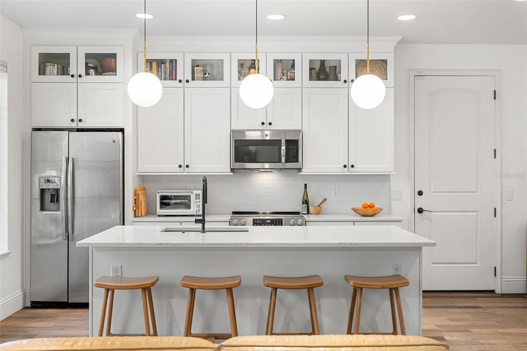 1732 Ridgewood Avenue, Unit S Maitland, FL 32751 - Photo 9 of 31 a kitchen with cabinets and stainless steel appliances