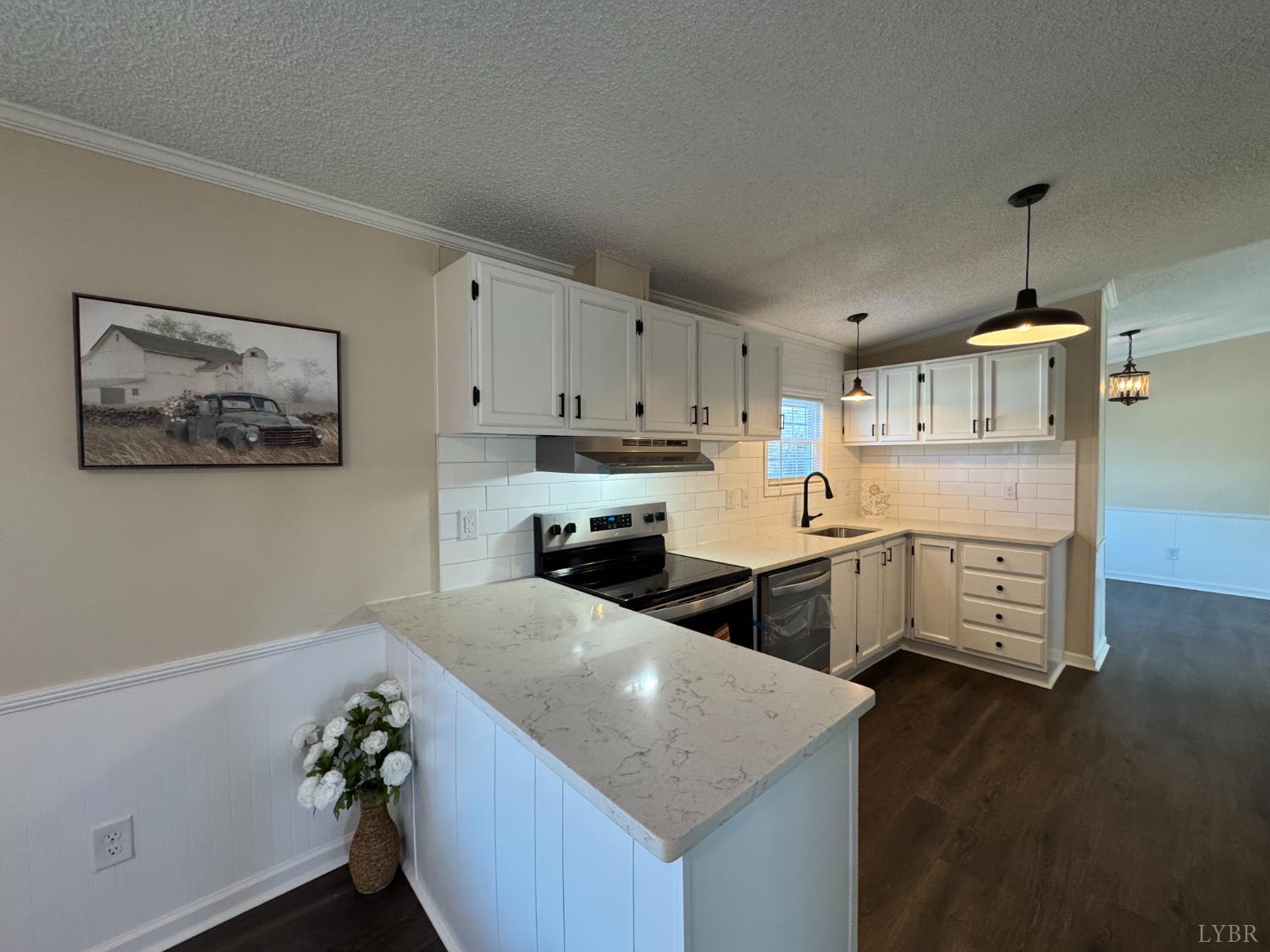 5532 Watt Abbitt Road Appomattox, VA 24522 - Photo 14 of 26 a kitchen with a sink a stove and cabinets