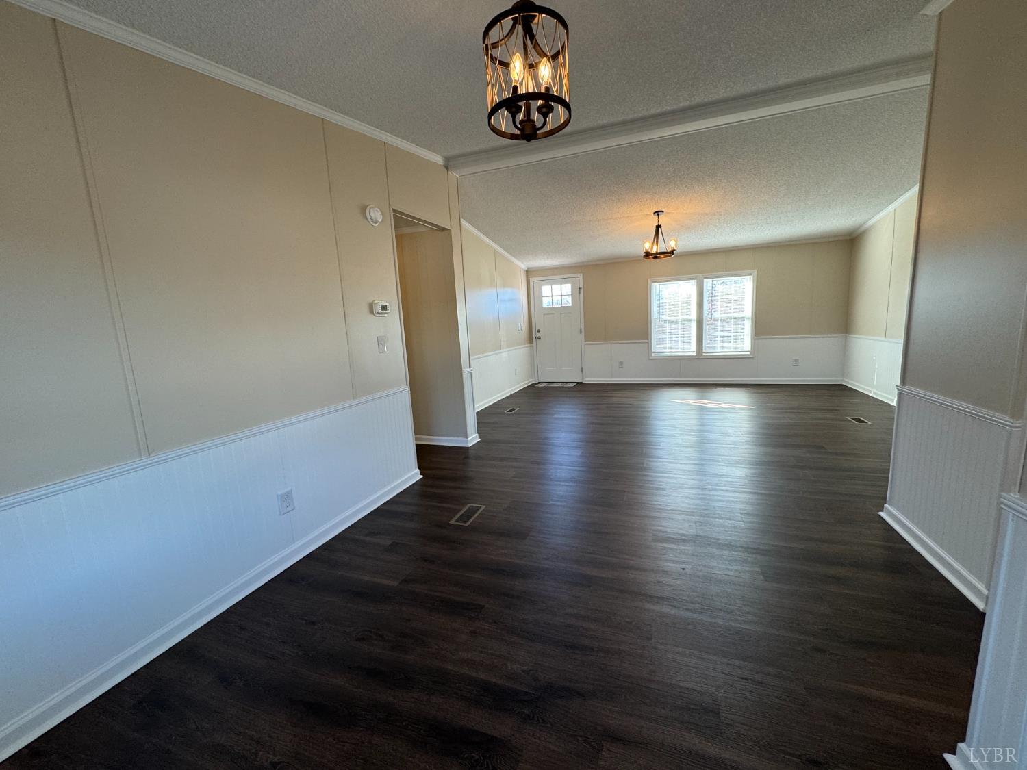 5532 Watt Abbitt Road Appomattox, VA 24522 - Photo 16 of 26 a view of an empty room with wooden floor and window