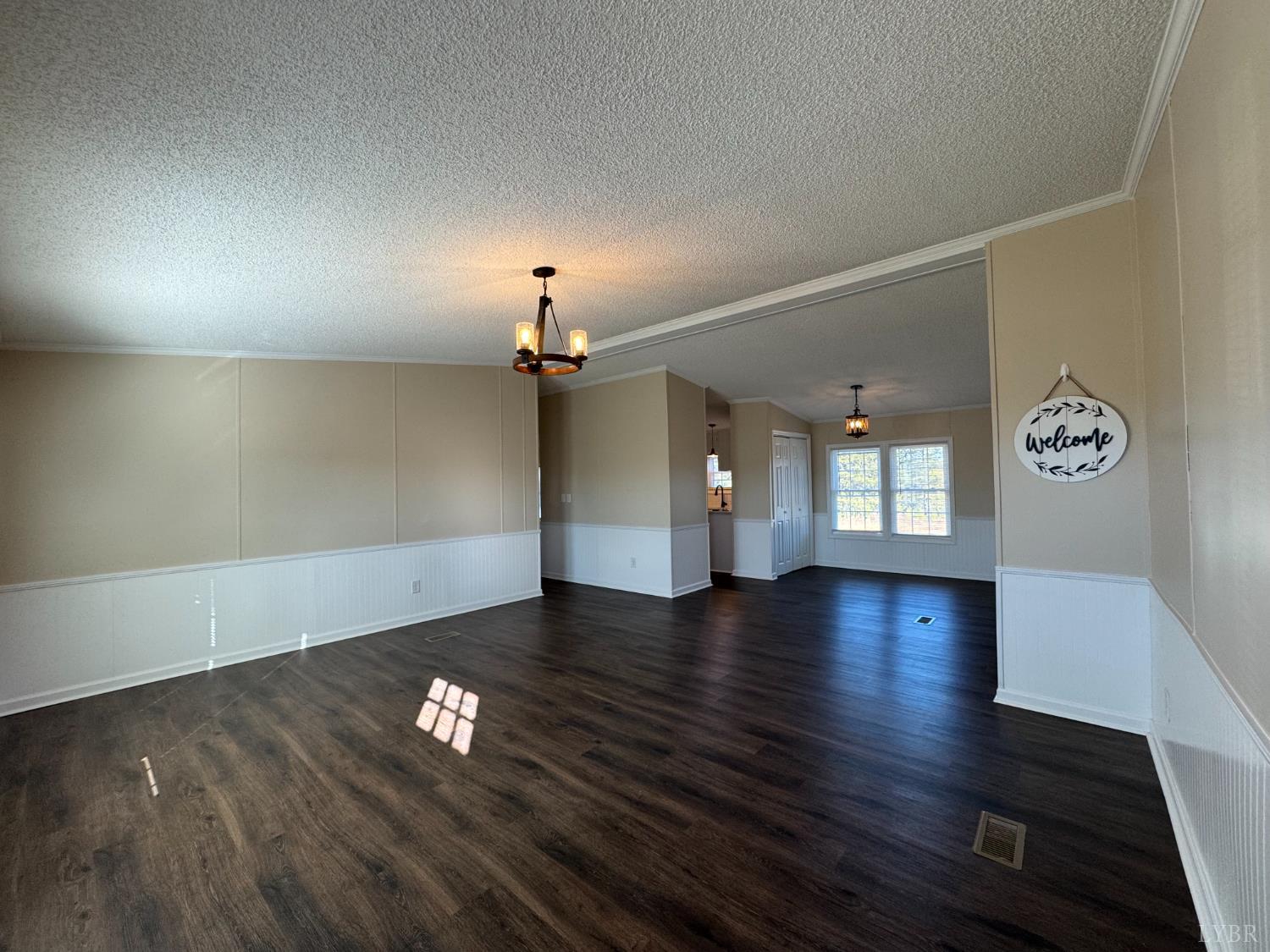 5532 Watt Abbitt Road Appomattox, VA 24522 - Photo 17 of 26 an empty room with wooden floor and windows
