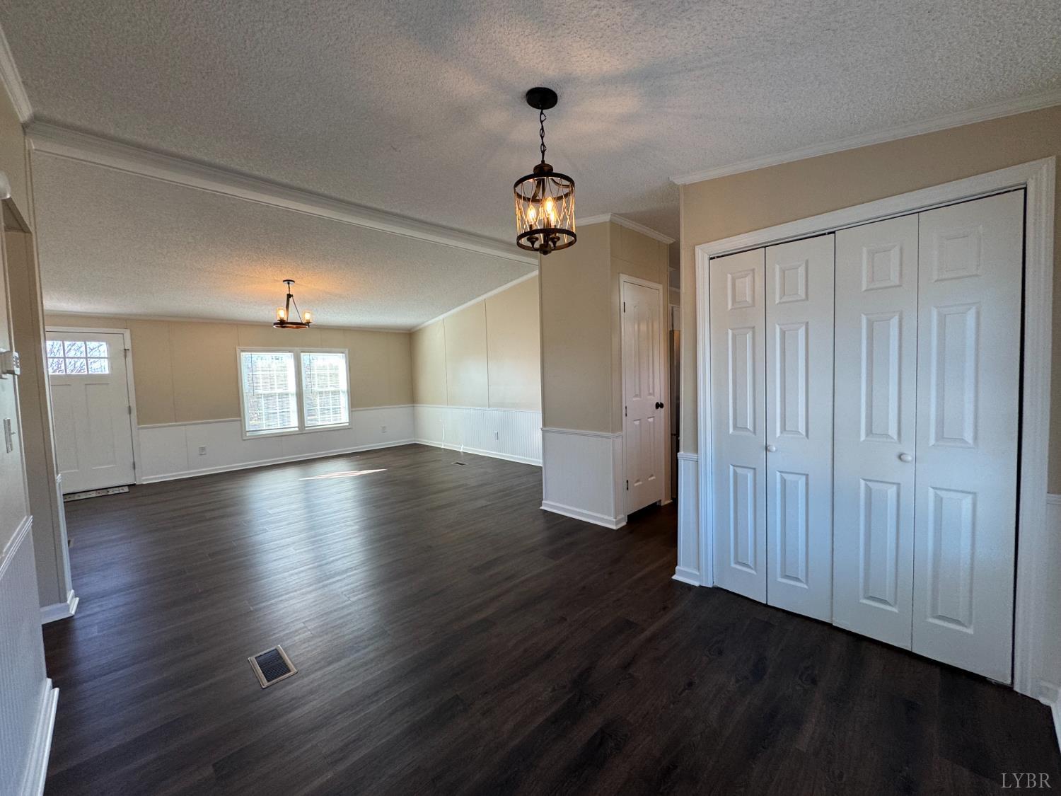 5532 Watt Abbitt Road Appomattox, VA 24522 - Photo 18 of 26 an empty room with wooden floor ceiling fan and windows