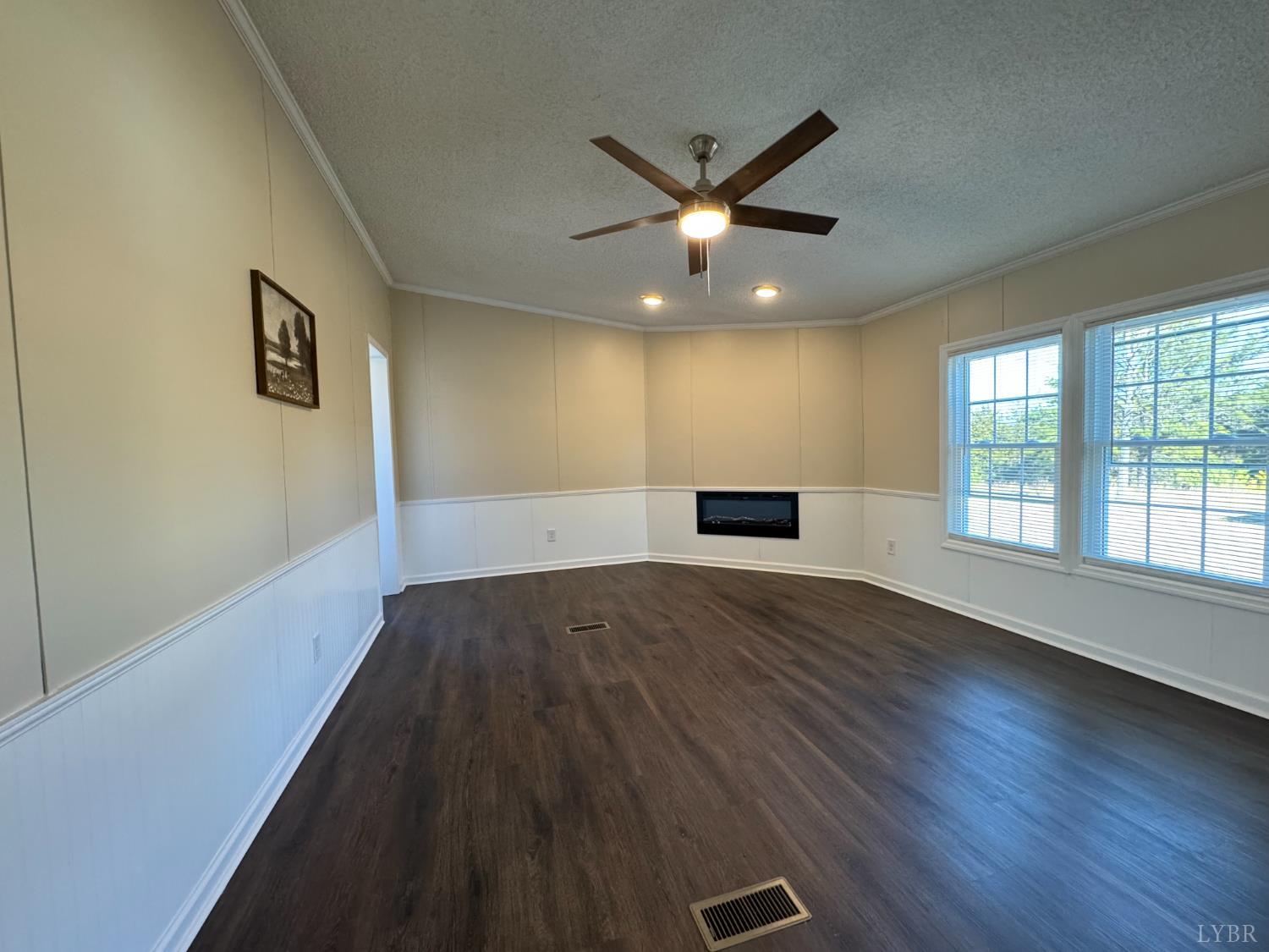 5532 Watt Abbitt Road Appomattox, VA 24522 - Photo 20 of 26 a view of an empty room with wooden floor and a window