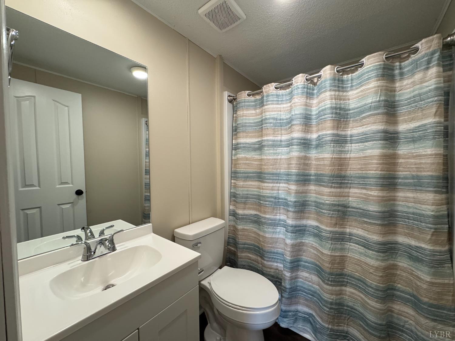 5532 Watt Abbitt Road Appomattox, VA 24522 - Photo 25 of 26 a bathroom with a sink toilet and shower
