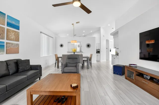 a kitchen with stainless steel appliances granite countertop a stove refrigerator sink and stove