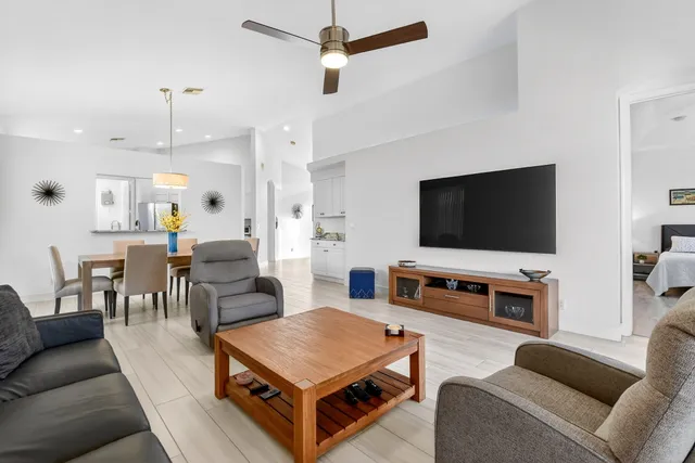 a kitchen with stainless steel appliances granite countertop a refrigerator stove and sink