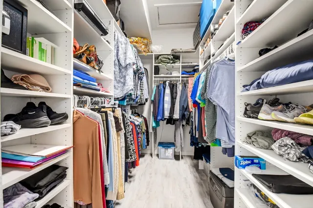 a bathroom with a double vanity sink mirror and bathtub