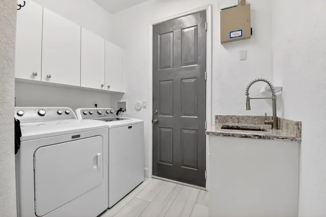 a view of a house with a yard patio and swimming pool