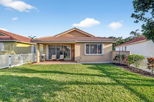 an aerial view of residential house with outdoor space and pool