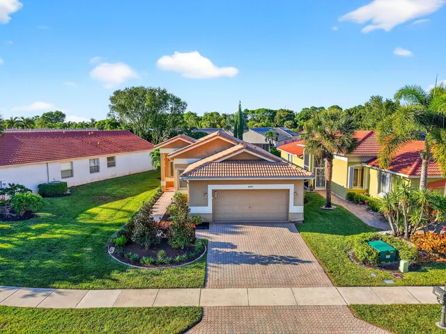 a view of a swimming pool with a table and chairs