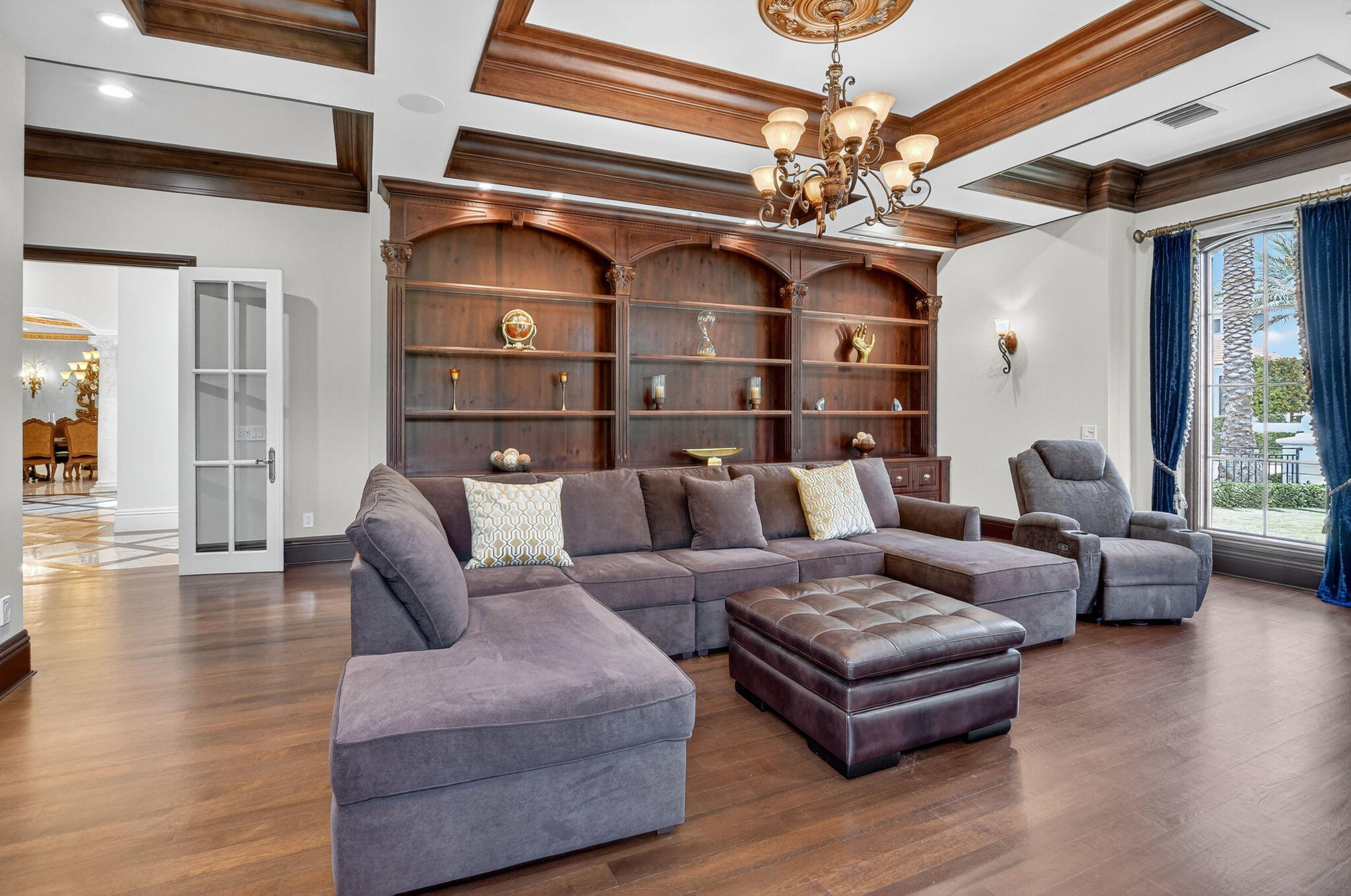 377 East Coconut Palm Road Boca Raton, FL 33432 - Photo 16 of 113 a living room with furniture and a chandelier