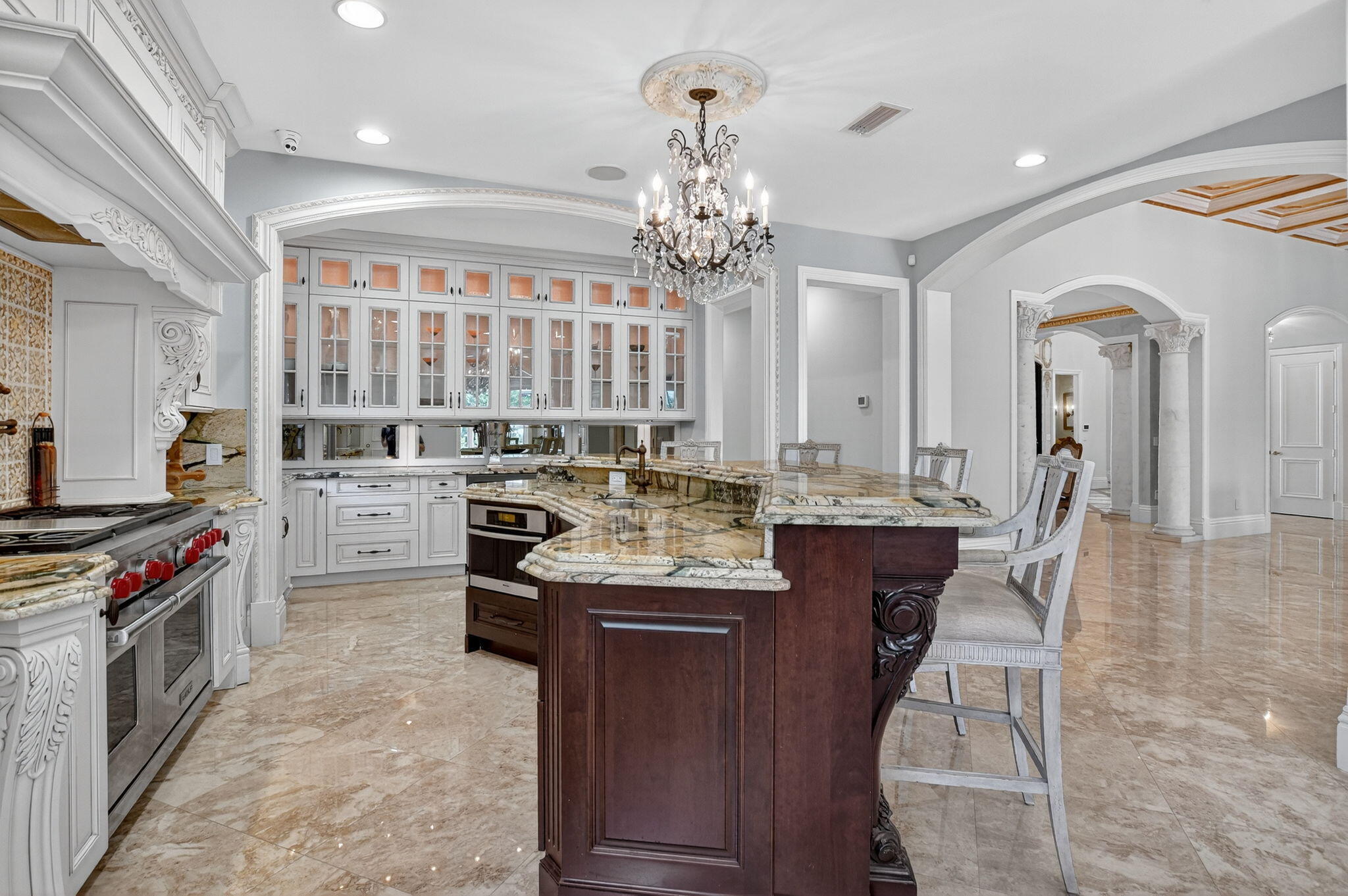 377 East Coconut Palm Road Boca Raton, FL 33432 - Photo 36 of 113 a kitchen with stainless steel appliances granite countertop a stove top oven a sink dishwasher with a dining table and chairs