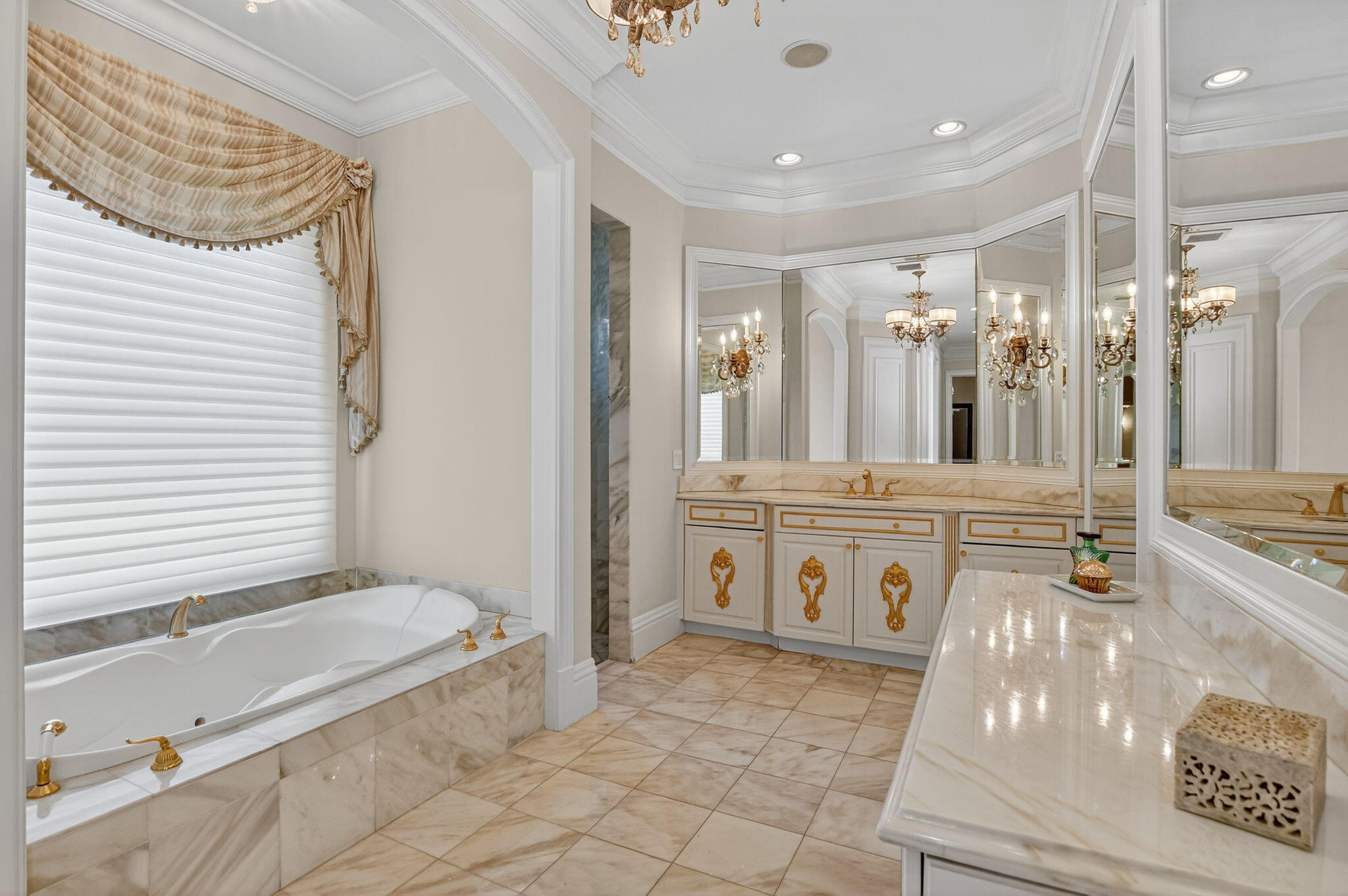 377 East Coconut Palm Road Boca Raton, FL 33432 - Photo 57 of 113 a bathroom with a tub a sink and a mirror
