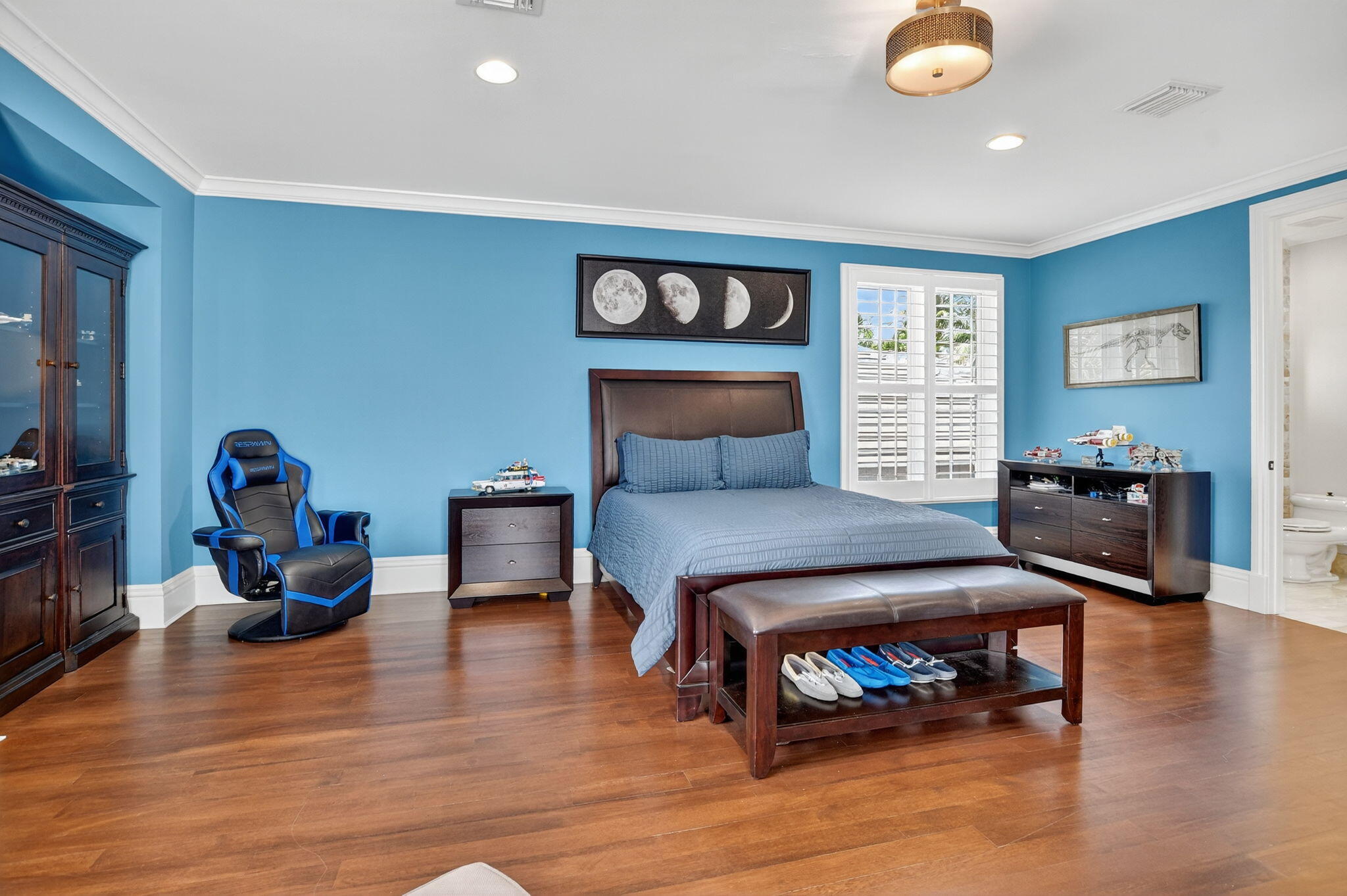 377 East Coconut Palm Road Boca Raton, FL 33432 - Photo 62 of 113 a bedroom with furniture and a wooden floor