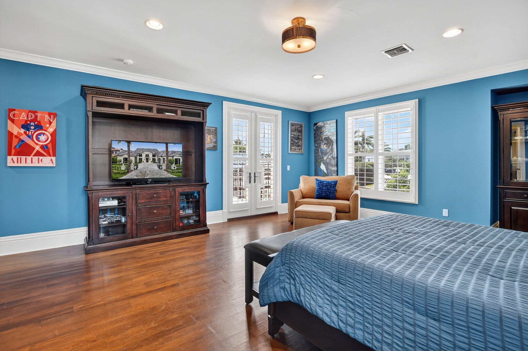 377 East Coconut Palm Road Boca Raton, FL 33432 - Photo 63 of 113 a bedroom with a bed and wooden floor