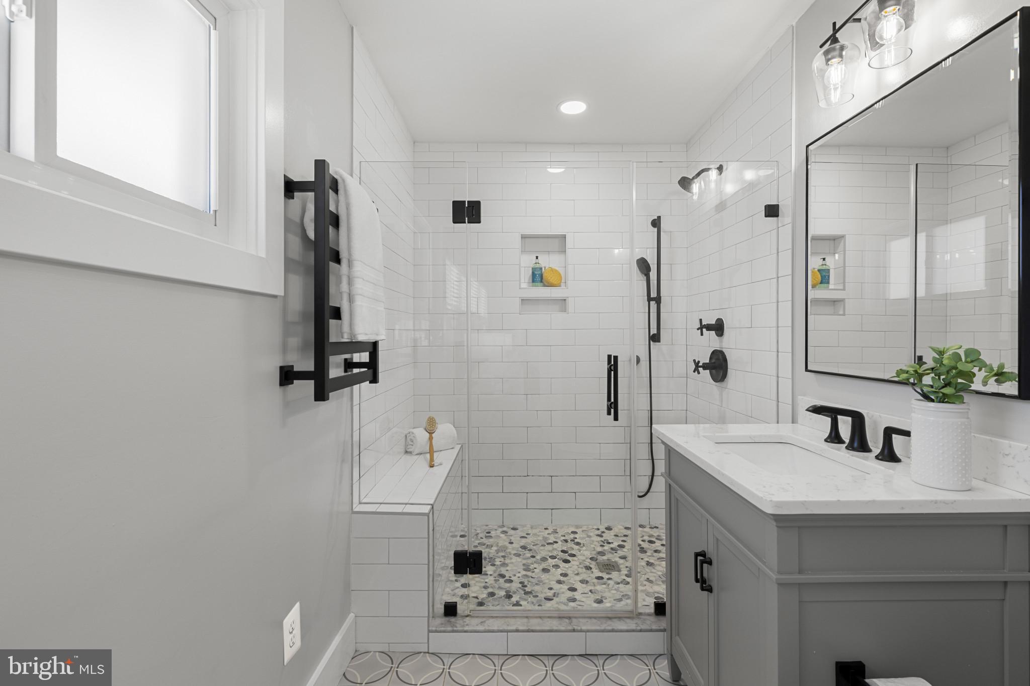 1519 Winchester Road Annapolis, MD 21409 - Photo 13 of 34 a bathroom with a sink a mirror and shower