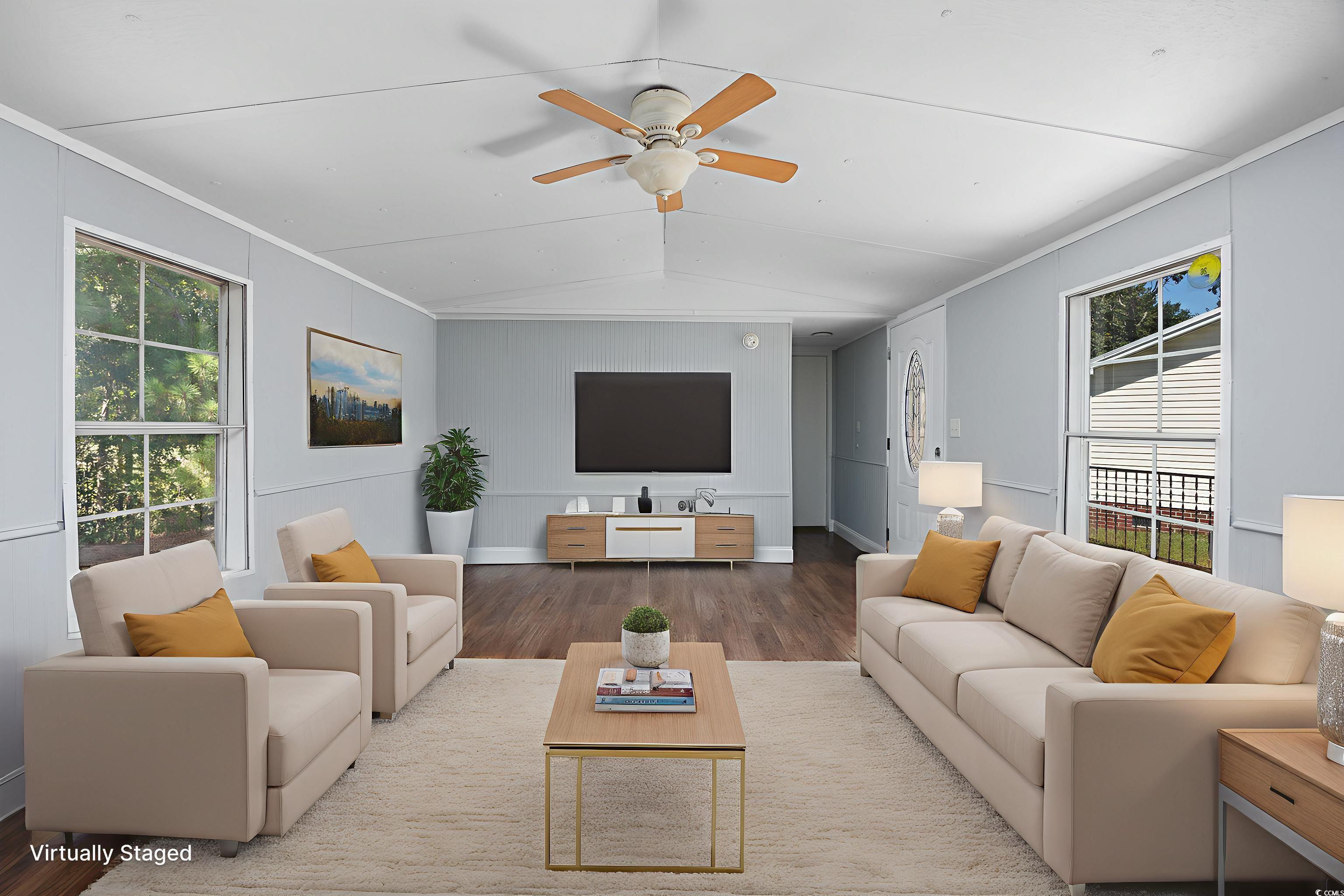 193 Nollie Road Myrtle Beach, SC 29588 - Photo 24 of 35 Living area featuring crown molding, wood finished floors, vaulted ceiling, and ceiling fan