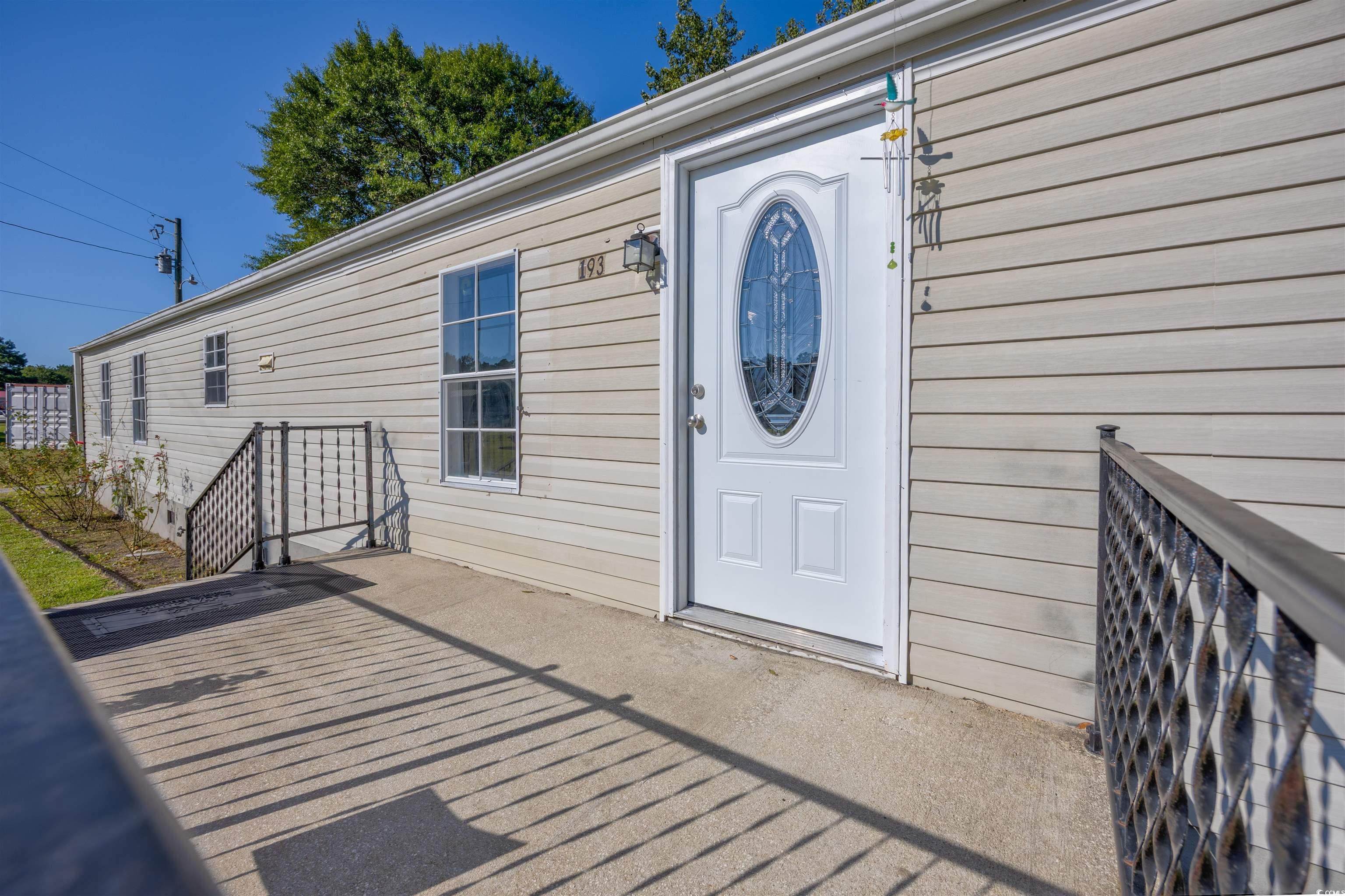 193 Nollie Road Myrtle Beach, SC 29588 - Photo 5 of 35 Property entrance featuring a patio