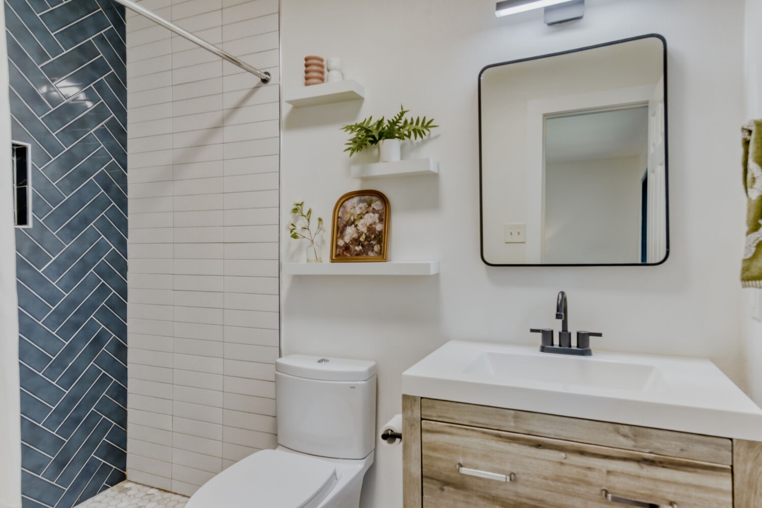6108 Bridlington Circle Austin, TX 78745 - Photo 13 of 22 a bathroom with a toilet sink and mirror