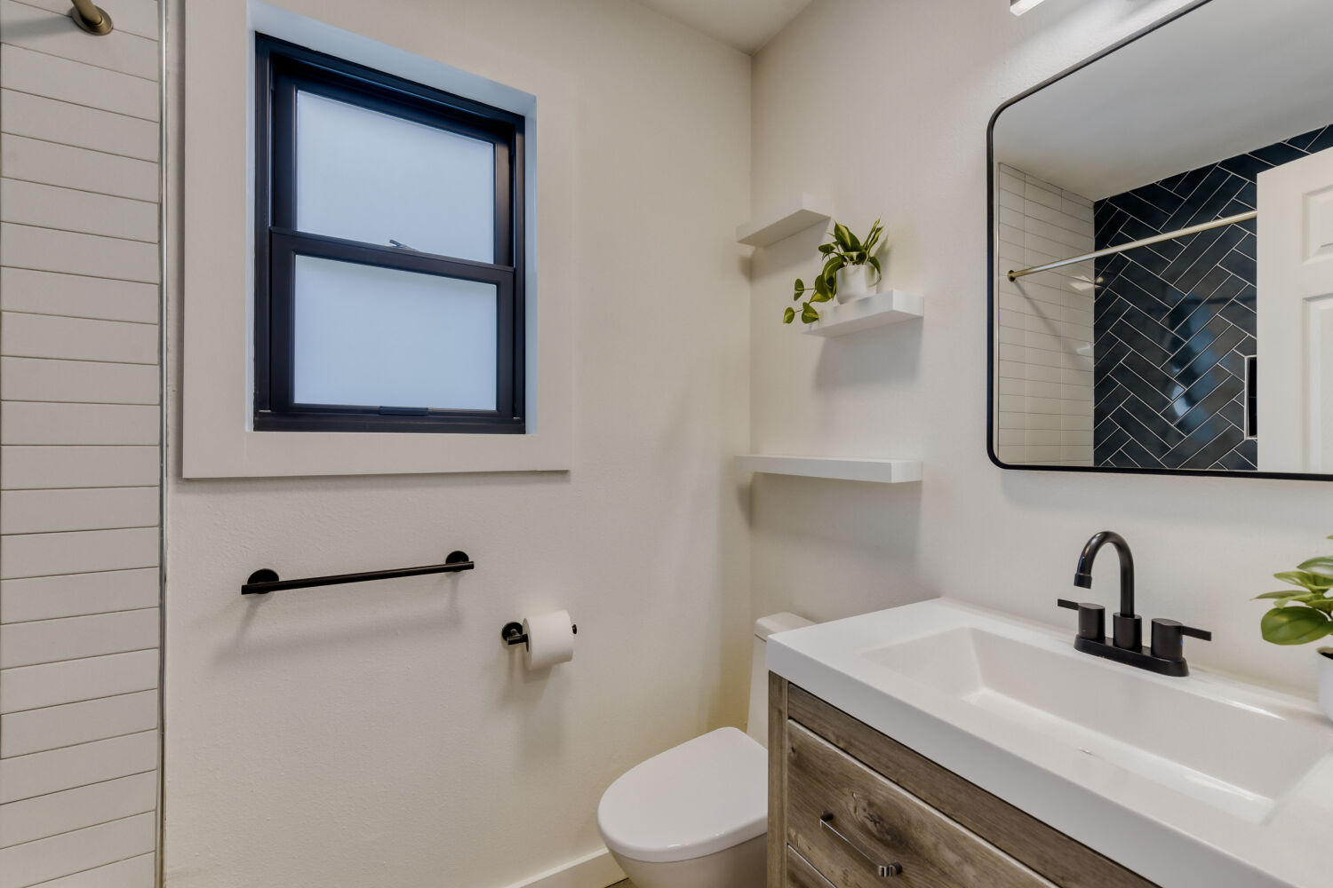 6108 Bridlington Circle Austin, TX 78745 - Photo 17 of 22 a bathroom with a toilet a sink and mirror