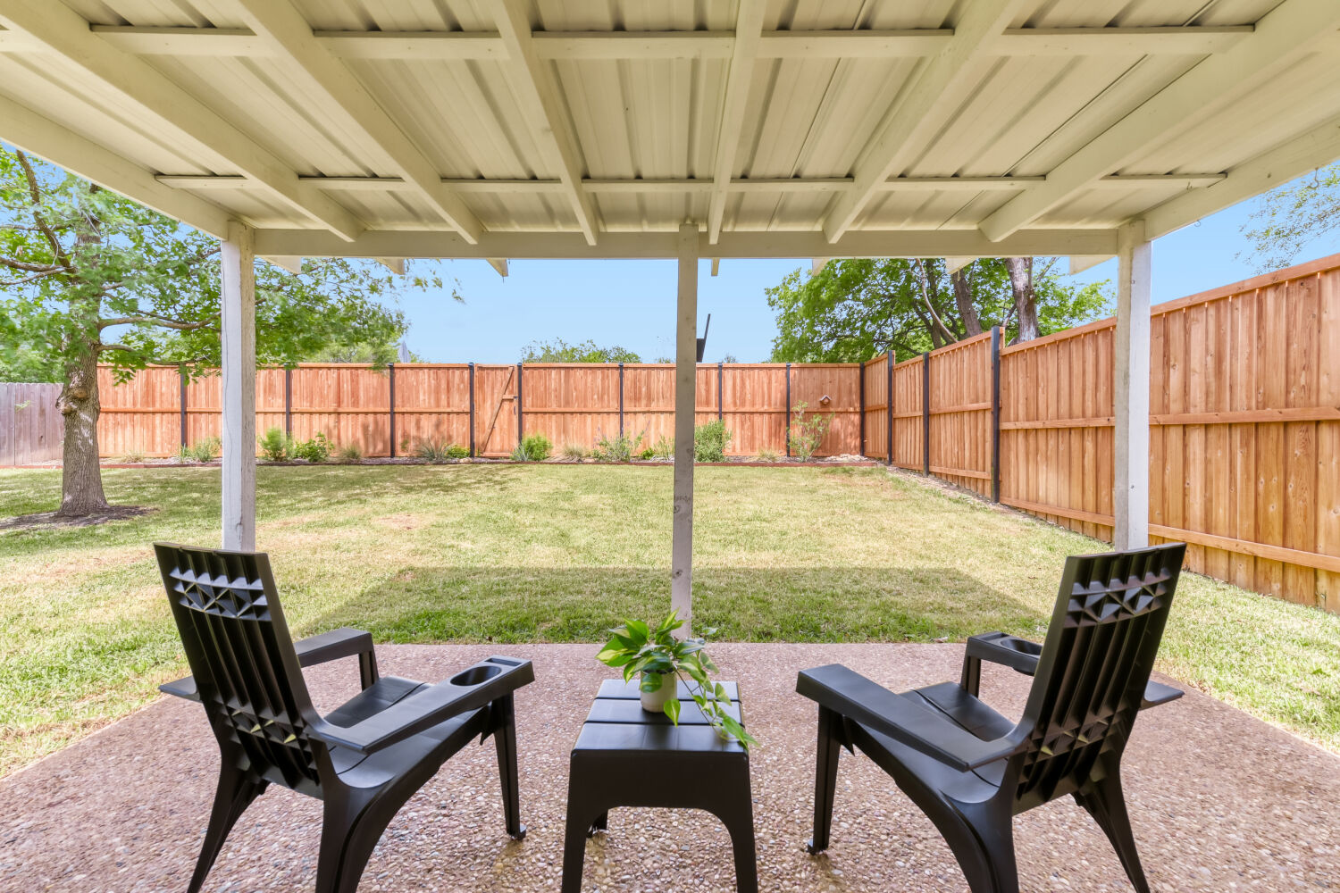6108 Bridlington Circle Austin, TX 78745 - Photo 20 of 22 a backyard of a house with table and chairs