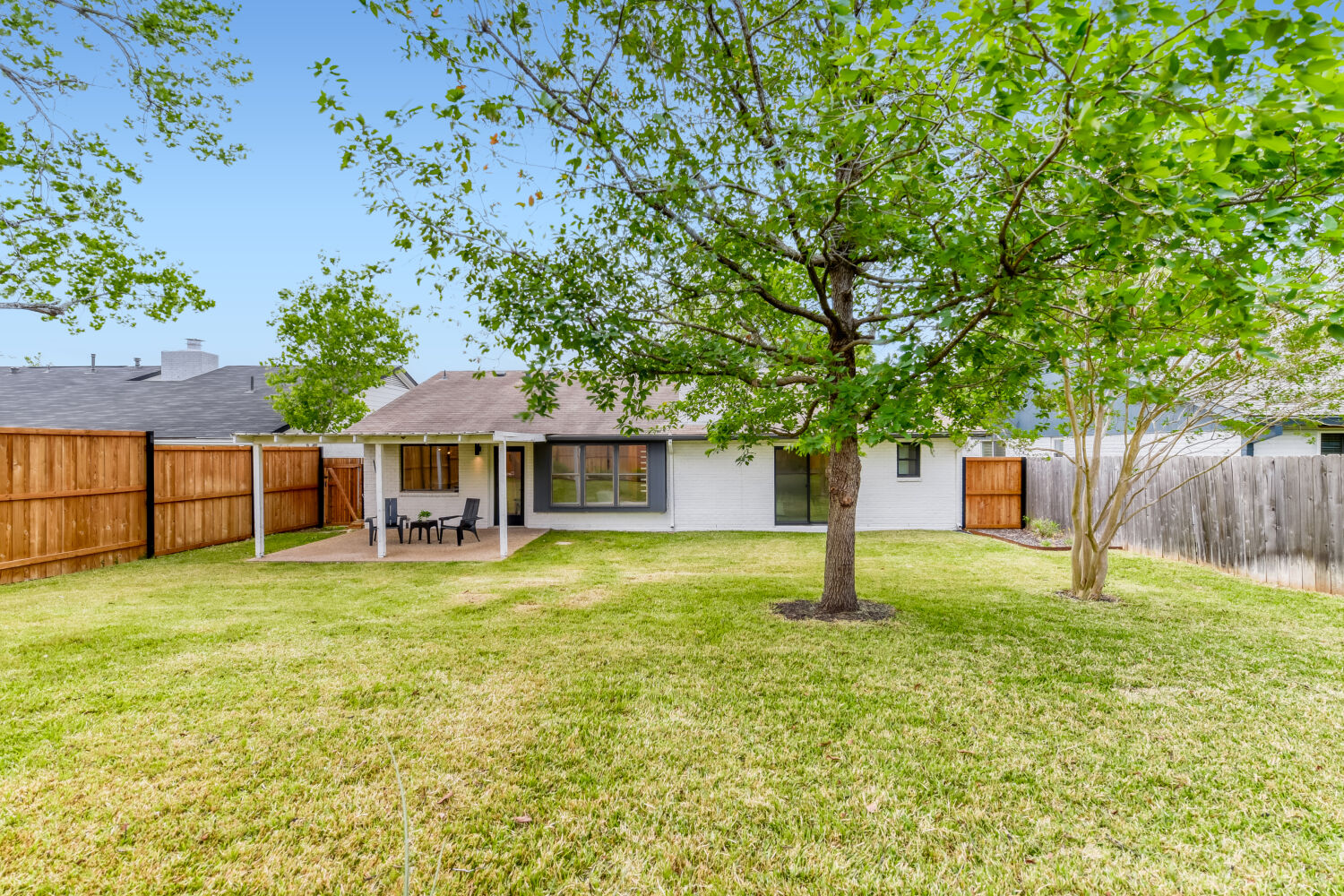 6108 Bridlington Circle Austin, TX 78745 - Photo 21 of 22 a backyard of a house with table and chairs