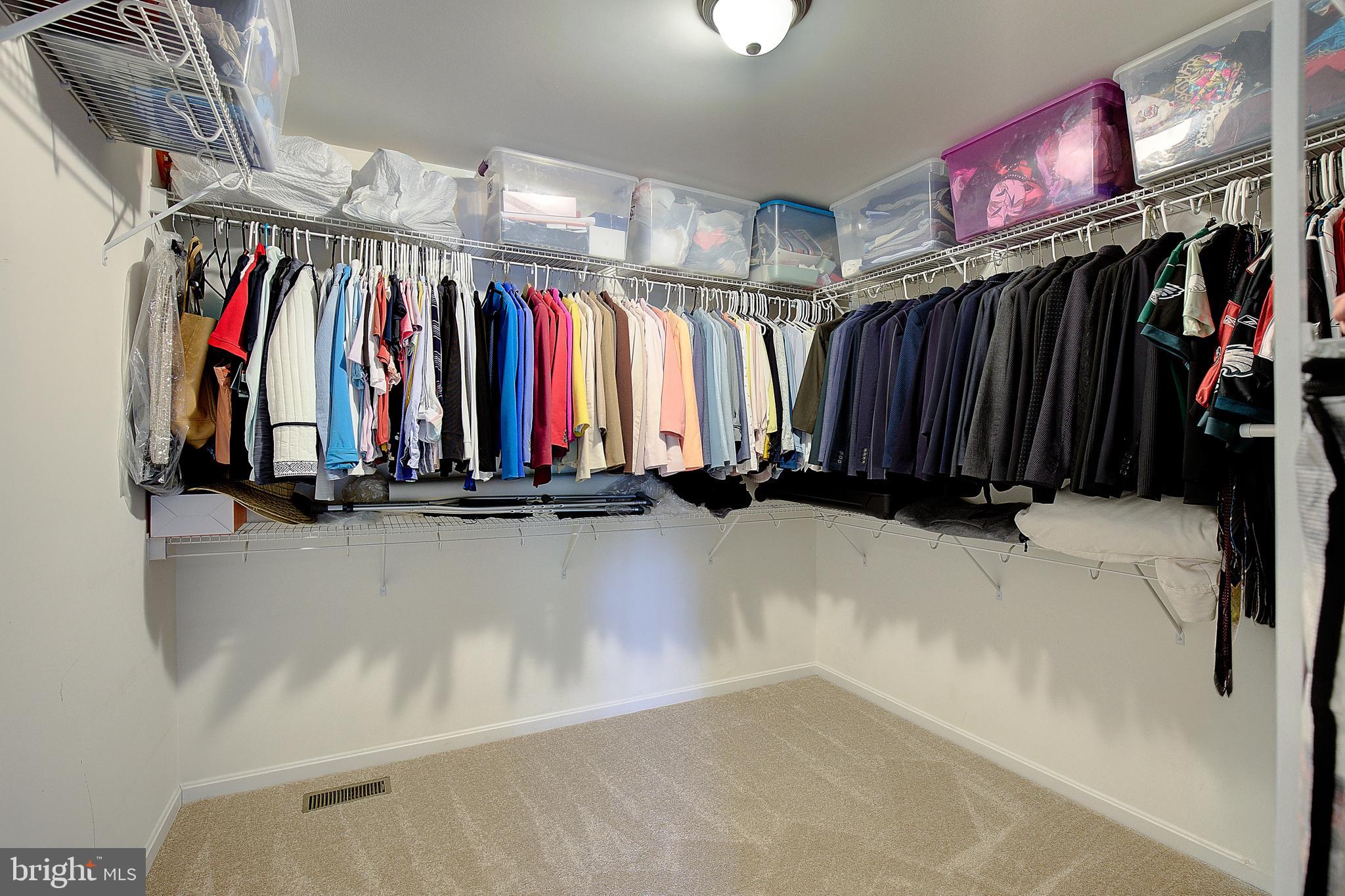 403 Venton Road Edgewater, MD 21037 - Photo 32 of 62 a view of walk in closet with clothes and shoes