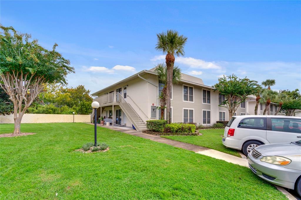 1935 South Conway Road, Unit F5 Orlando, FL 32812 - Photo 1 of 1 a front view of a house with garden