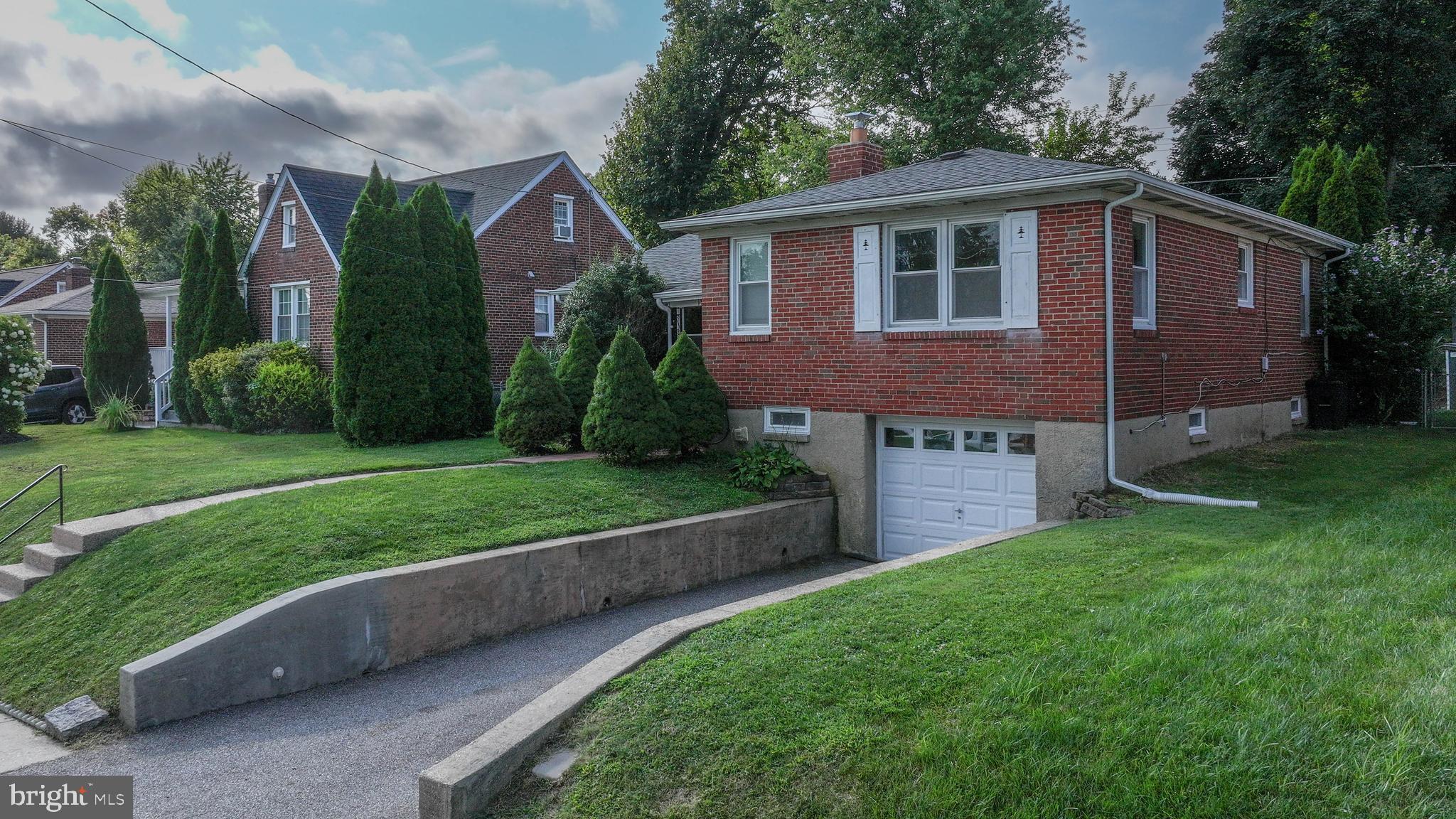 1921 Old Frederick Road Baltimore, MD 21228 - Photo 3 of 39 a view of a house with a yard and plants