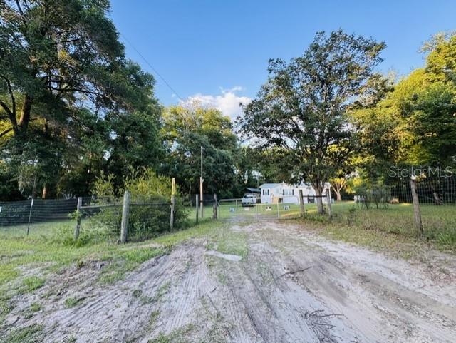 11817 Southwest 58th Street Webster, FL 33597 - Photo 42 of 46 a backyard of a house with lots of green space